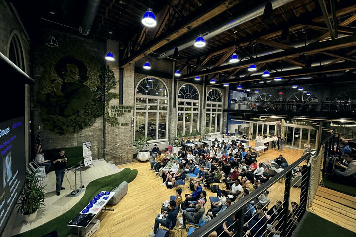 The Fall 2024 Innovation Lab kickoff, seen from the balcony of a packed atrium.